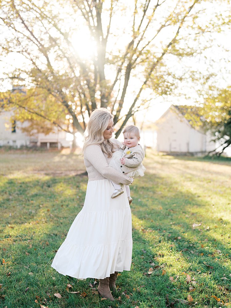 A Mother Holds Her Infant Daughter In Jones Point Park Va.