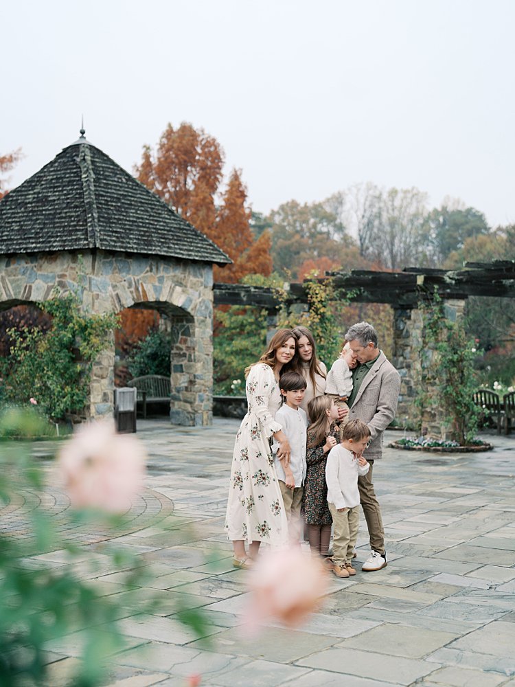 A Mother Looks At The Camera During Their Lewis Ginter Botanical Garden Photos.