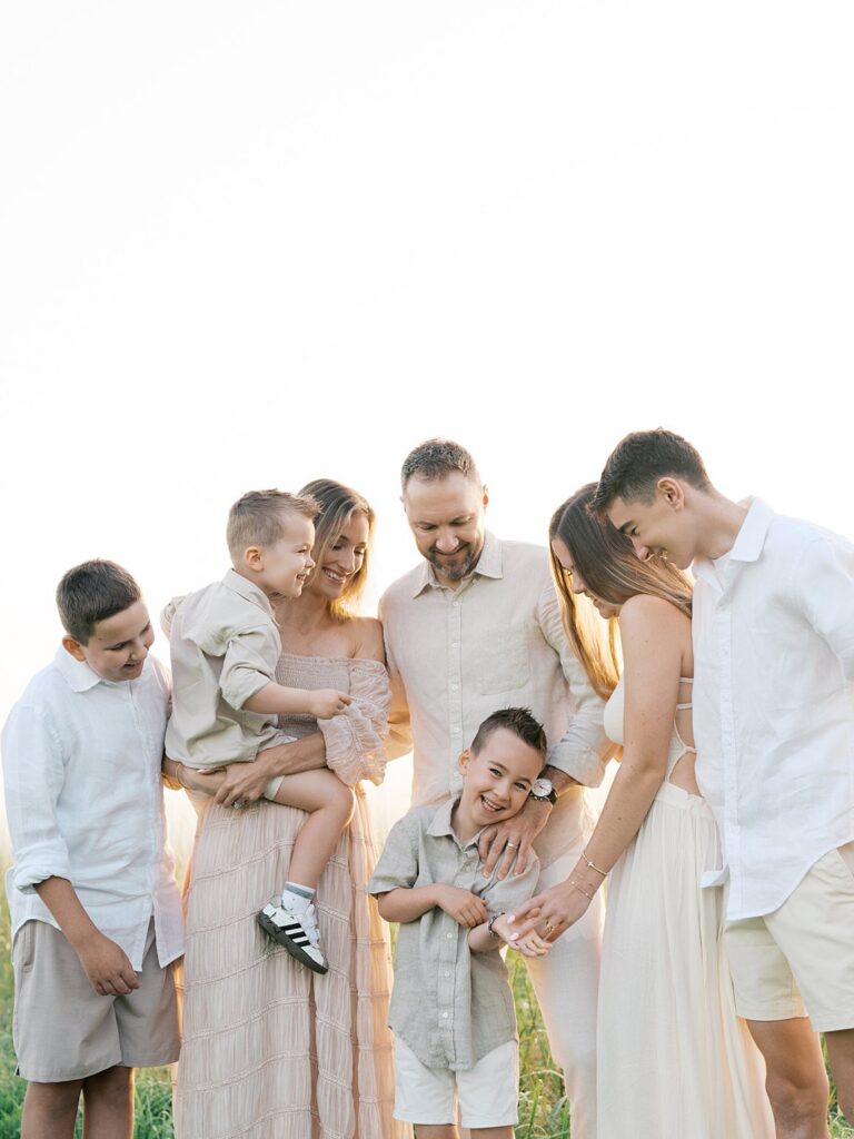 Family Of Six Laughing Together At Sunrise During A Manassas Battlefield Session With A Gainesville Photographer