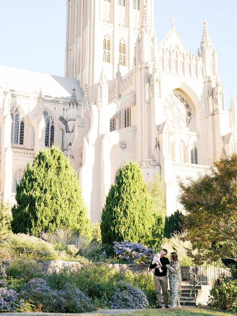 Family Stands Among The Gardens Below The Gothic Spires Of Washington National Cathedral, A Session In The Bishop's Garden, One Of The Best Washington Dc Fall Foliage Locations.