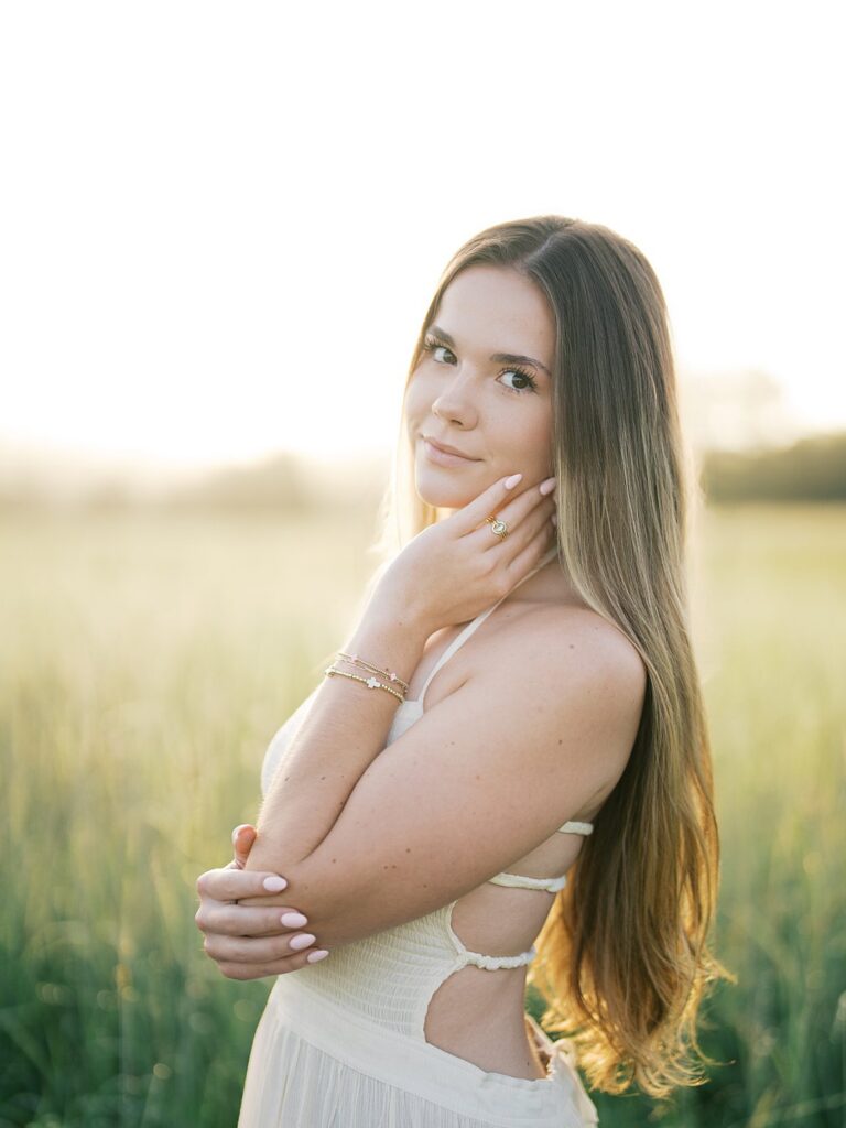 Young Woman In A White Dress Posing In A Sunlit Field At Manassas Battlefield, Captured By A Gainesville Photographer