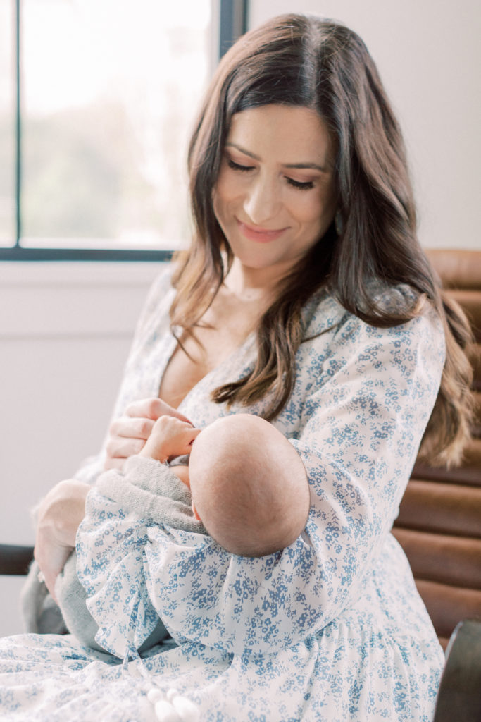 Mother holding her baby during a DC newborn photography session
