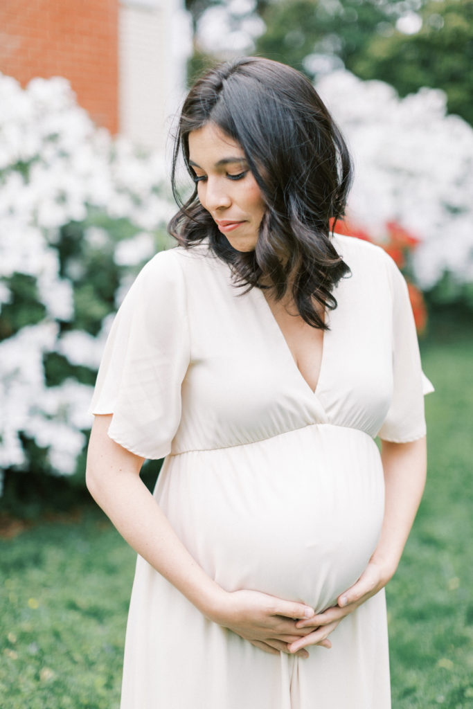 A pregnant mother holding her belly in a DC-area maternity shoot.