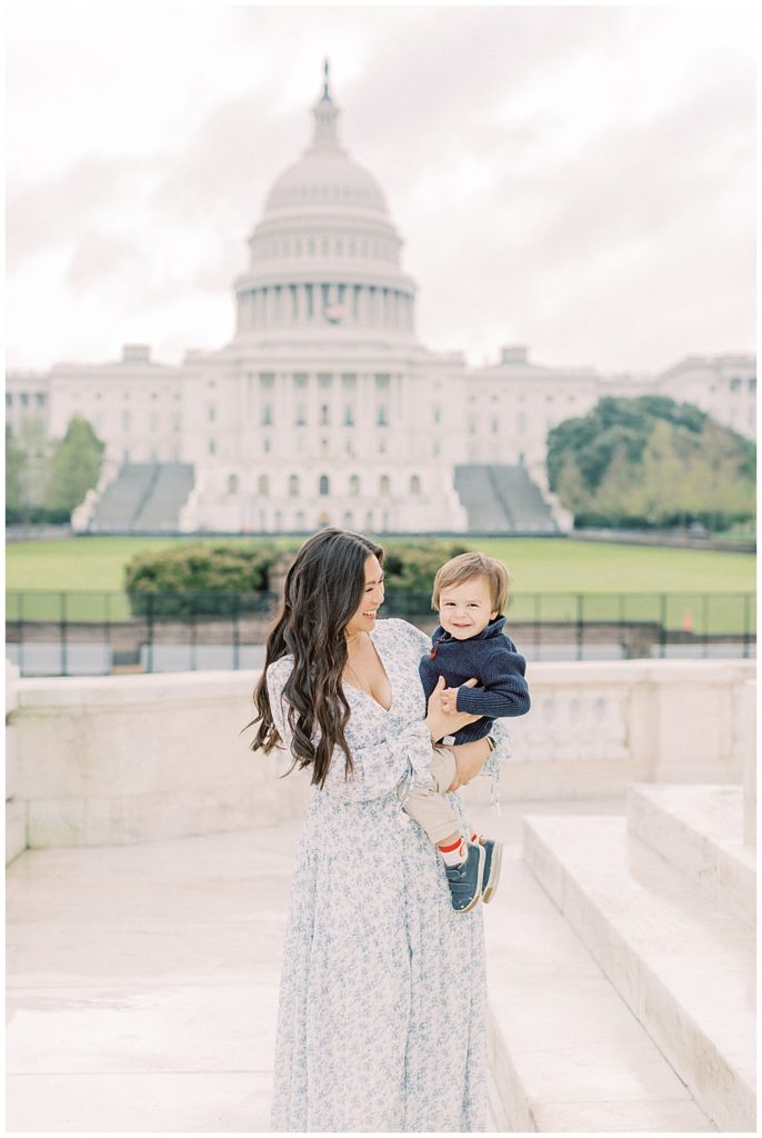 Mom holds her son for their US Capitol family photo session
