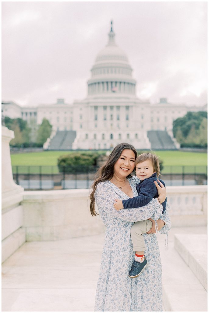 Mother smiles with her son during their DC family photo session at the Capitol