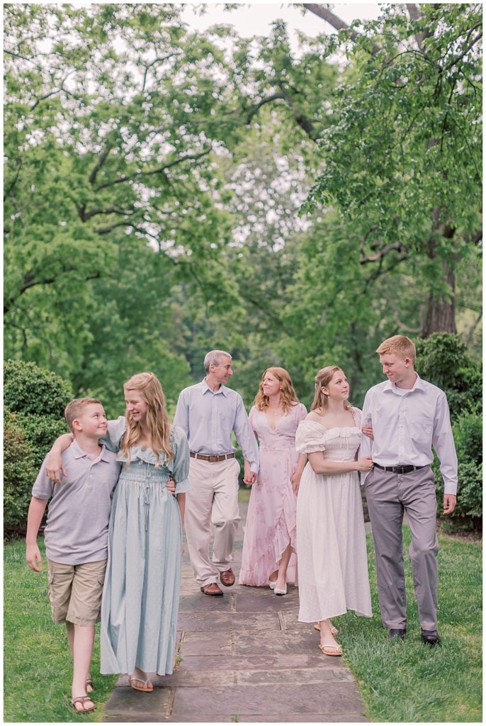 Large family walks together during their family photo session at Glenview Mansion | Northern Virginia Family Photographer