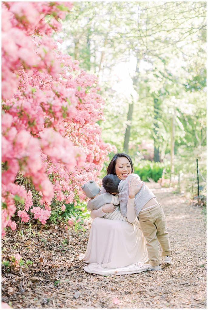 Washington, D.C. Family Photographer | Mother and son hug near the azaleas at Brookside Gardens in spring