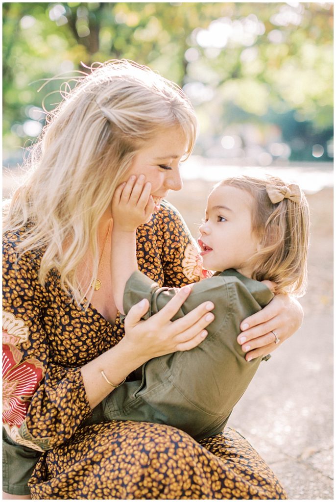 Mother and daughter embrace during their DC family photos in Lincoln Park