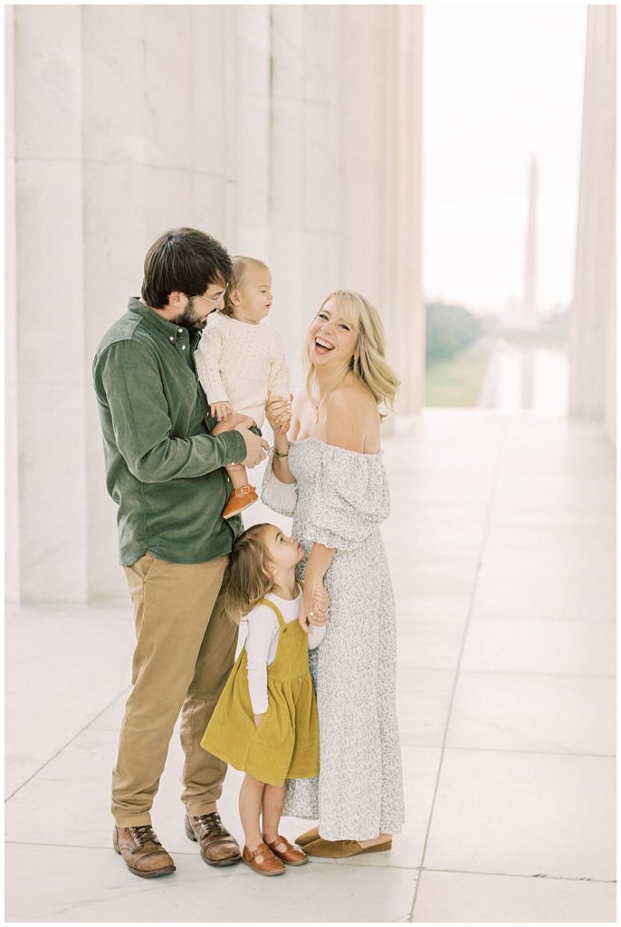 Family stands together at the Lincoln Memorial in DC