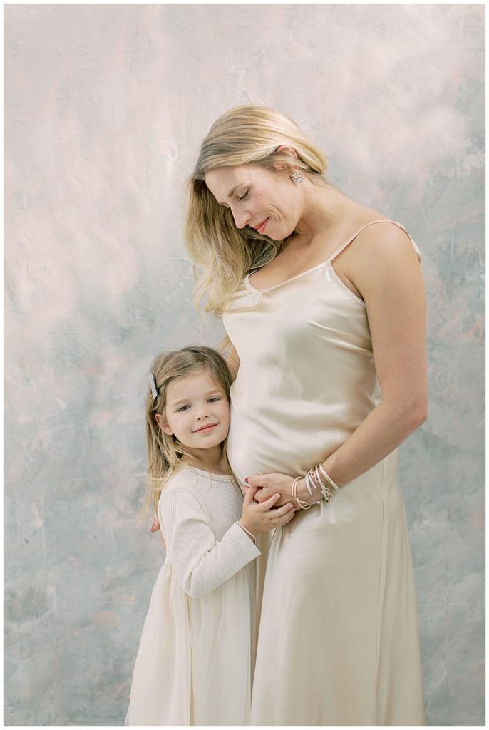 Mother looks adoringly down at her daughter in a Northern VA studio session
