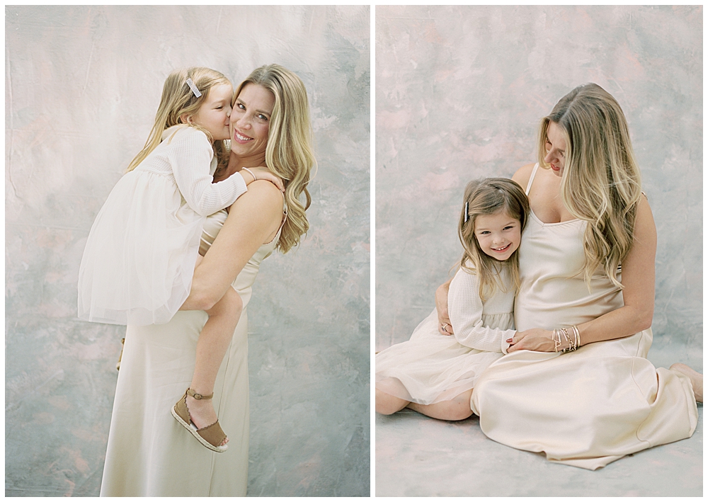 Mother and daughter embrace during studio maternity session