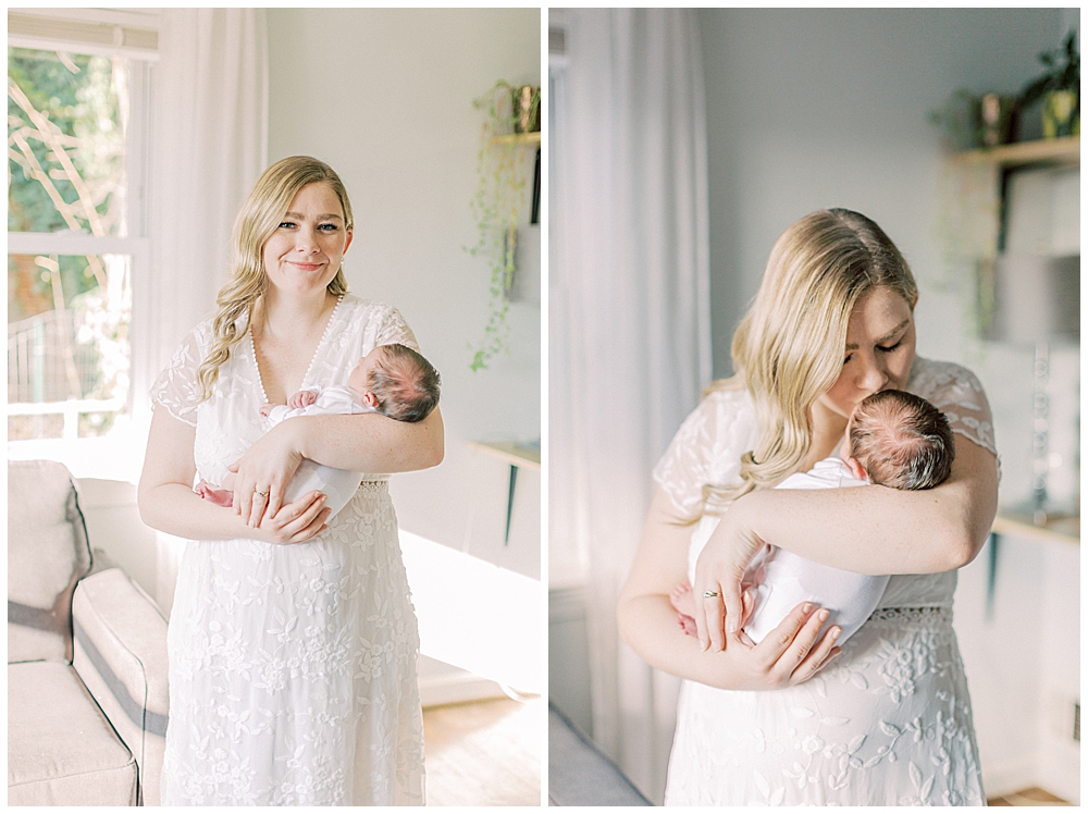 A blonde mother holds her newborn baby and smiles and kisses the baby's head