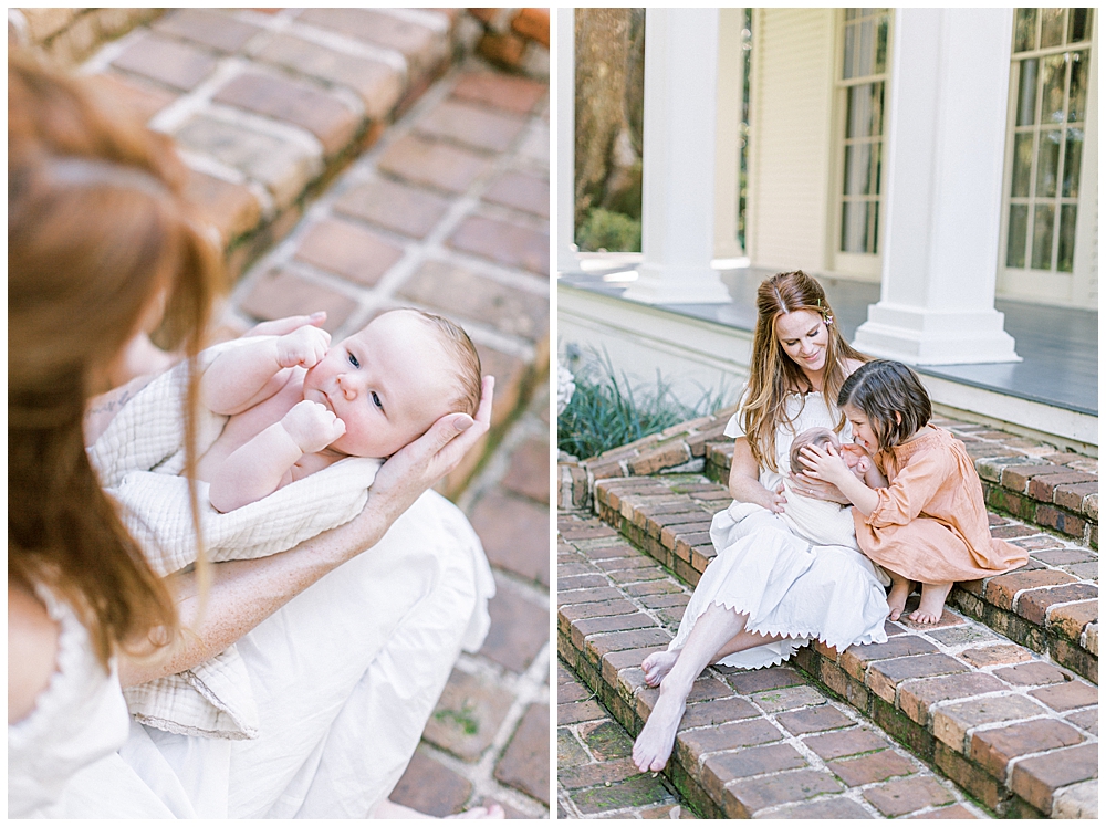 Mother and daughter sit on brick steps outside with their newborn baby boy