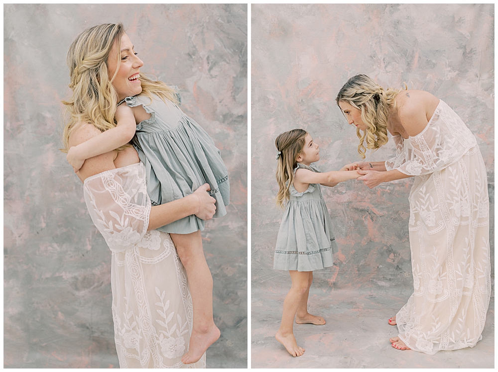 Mother and daughter dance and hug during their family photo session in a studio in Bethesda Maryland