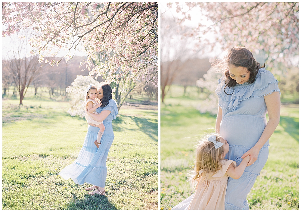 Pregnant mother wearing a blue Morning Lavender dress kisses her daughter and has her daughter kiss her belly