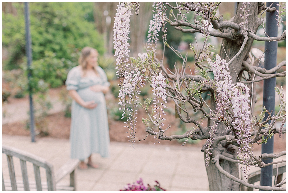 An out-of-focus image of a maternity session in Brookside Gardens.