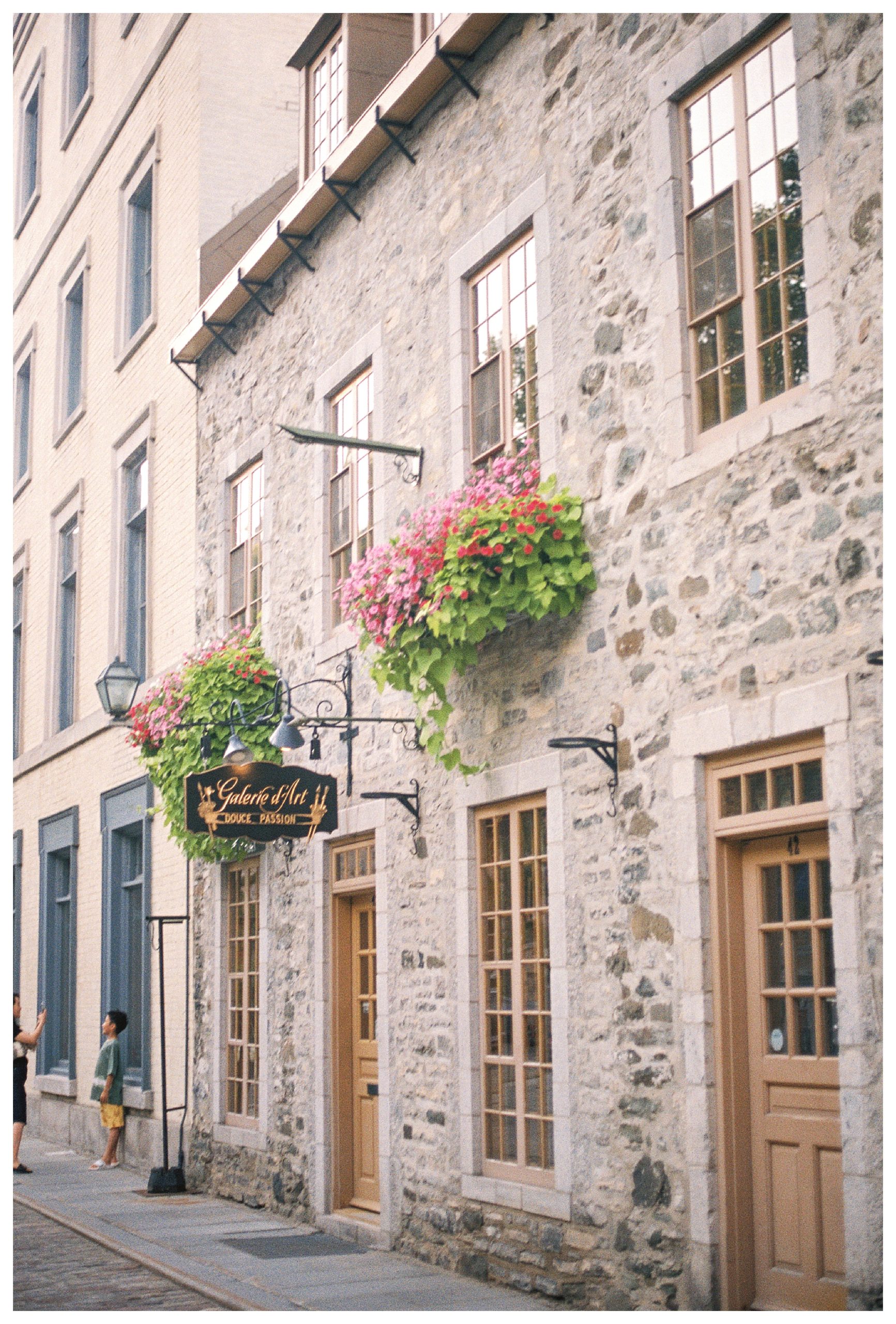 Exterior of a stone building store front in Quebec City.