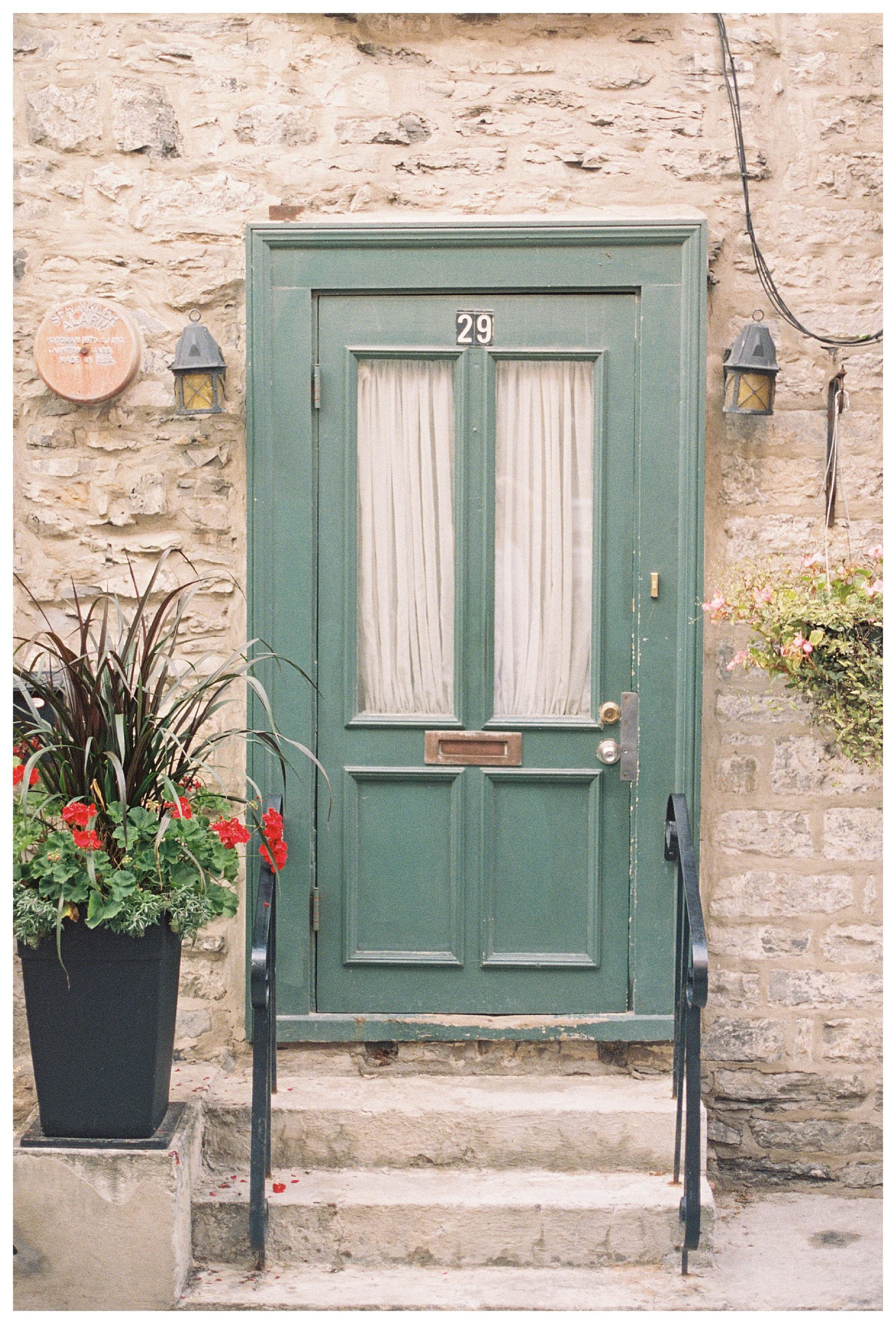 Green door on a stone house in Quebec City
