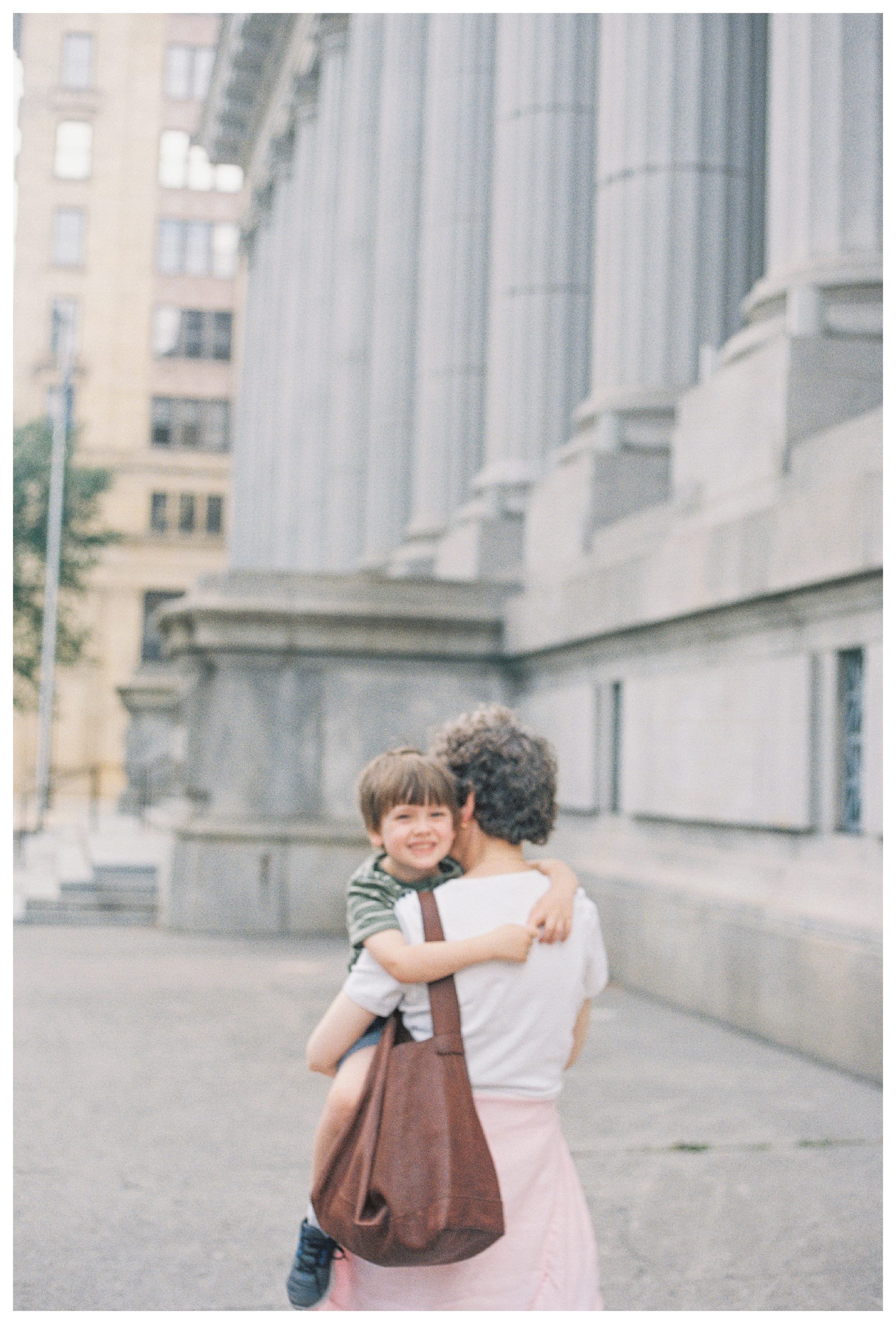 Little boy is held by his grandmother in Montreal, Canada