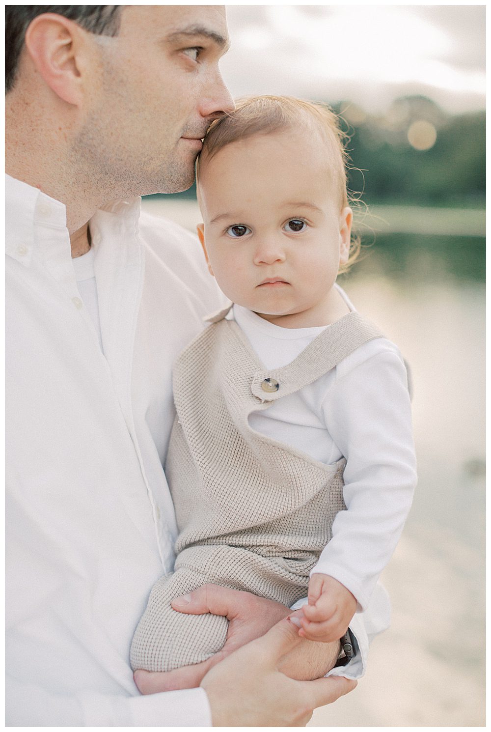 Father kisses his son's head during DC family photo session.