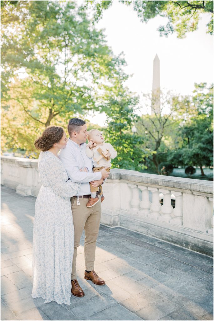 Mother and father hold their young son during DC family photo session at the DAR Constitution Hall.